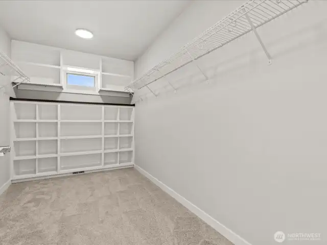 Huge walk in closet with custom built-in!