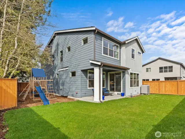 You will love sitting under you outdoor covered porch enjoying the lush and peaceful backyard!