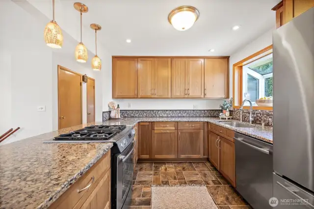 Remodeled kitchen with high-end kitchen cabinets, granite counter tops and stainless steel appliances.