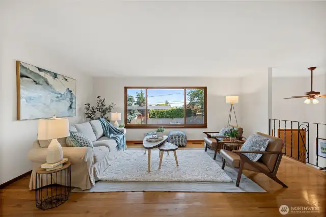 Spacious living room with large windows that flood the room with natural light.