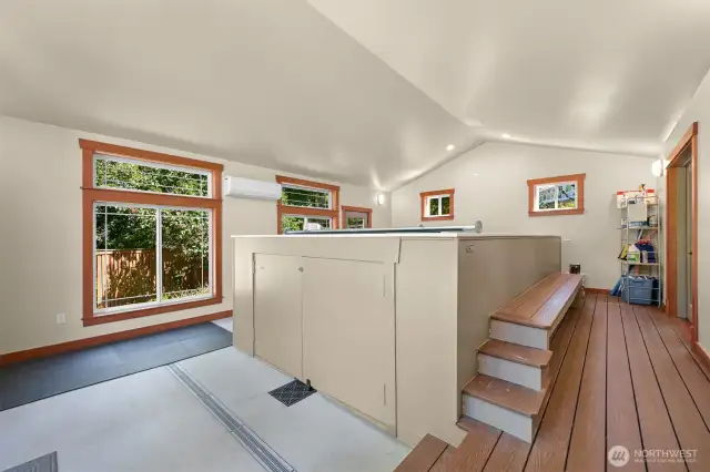 A photo of the poolhouse with the Endless pool (previous photo shows this space virtually staged as an ADU)