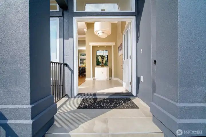 Grand entry with new staircase and railings.