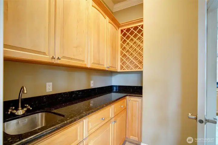 Jack and Jill doors connect the prep kitchen w/wine storage to kitchen and formal dining.