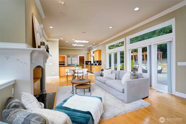 Second fireplace seating area looks out to the patios and terraced backyard