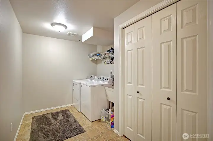 Huge laundry room w/ storage (lower level).