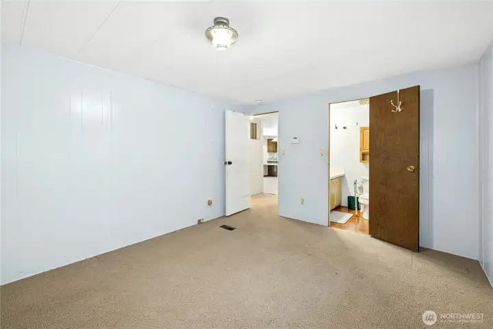 One of the three bedrooms with a connected bathroom.