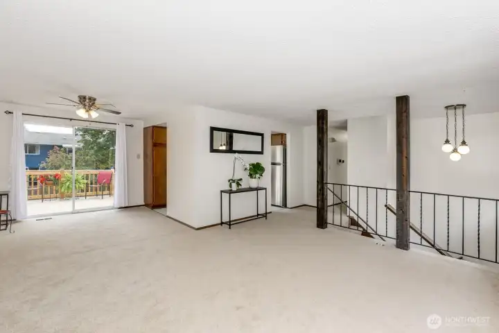Large living room connects to dining room and sliding glass door to deck.