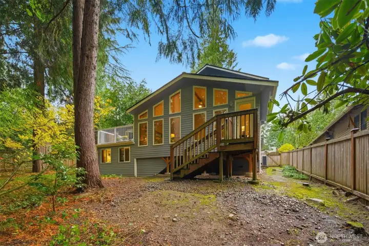 Low maintenance wooded lot. Room for a dog run at the side!