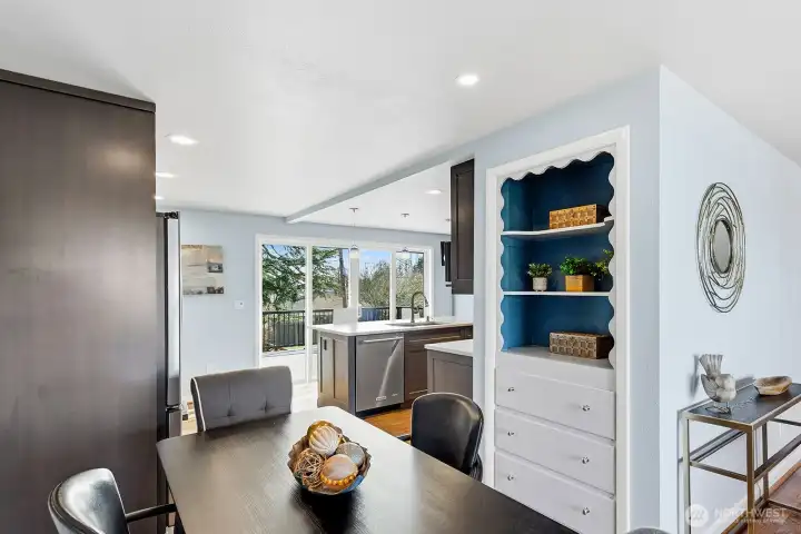 The dining area, opens to kitchen and living room. It can be cozy and intimate or expanded to accommodate a group.