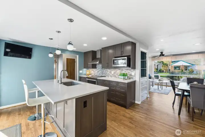 The kitchen is gorgeous. Remodeled in 2021 it features new cabinets, lighting, quartz counters, tile back splash and appliances.