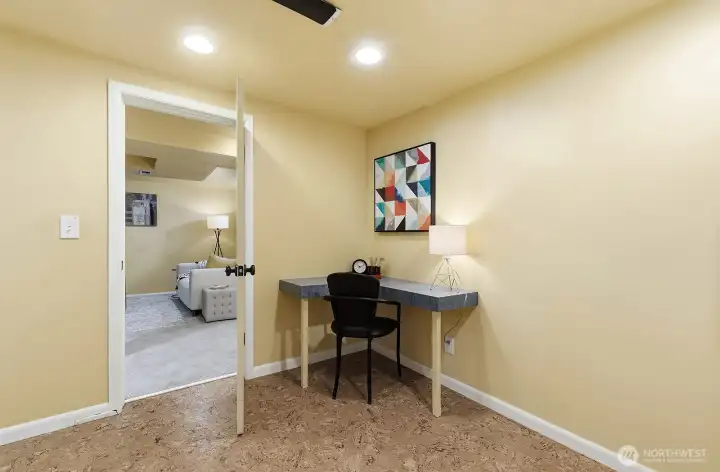 Corner desk in the lower entry makes a great spot for crafts of homework. Cork floors provide a homey warmth.