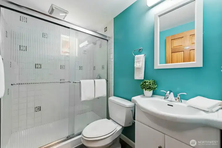 3/4 bath with tile shower stall and updated fixtures serves the lower level.