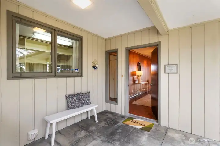 You will appreciate the covered from porch as you enter the front door