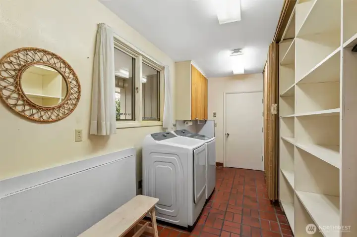 Fabulous utility room with folding table and again substantial storage