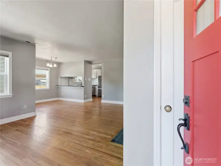 Entering into the living room with original hardwood floors