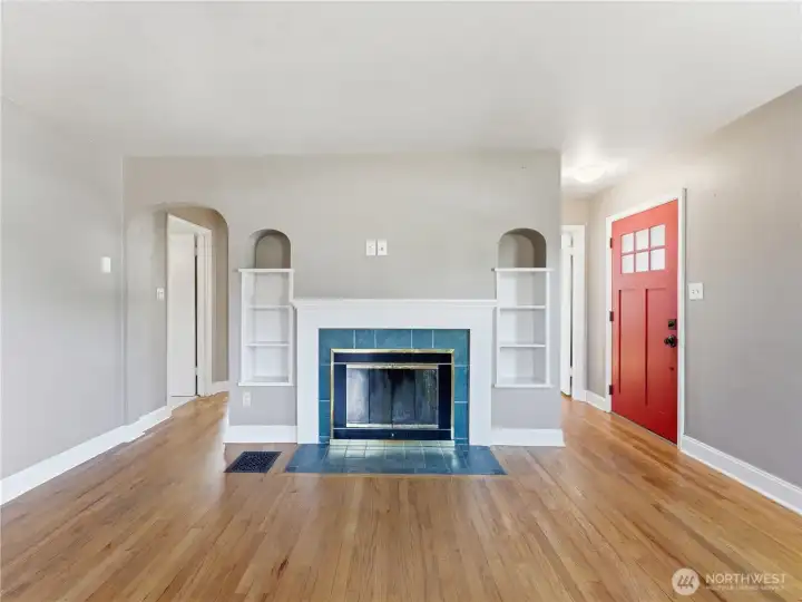 Main living with fireplace and original built ins.