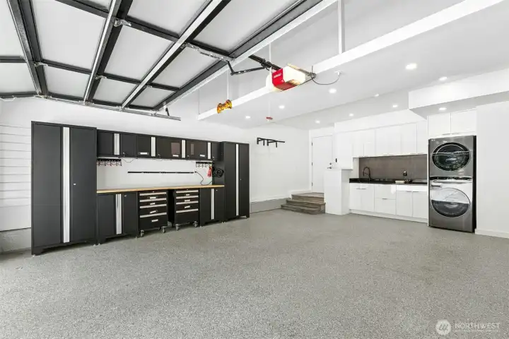Impeccable, updated 2-car garage with epoxy floors, built-in storage, and utility sink