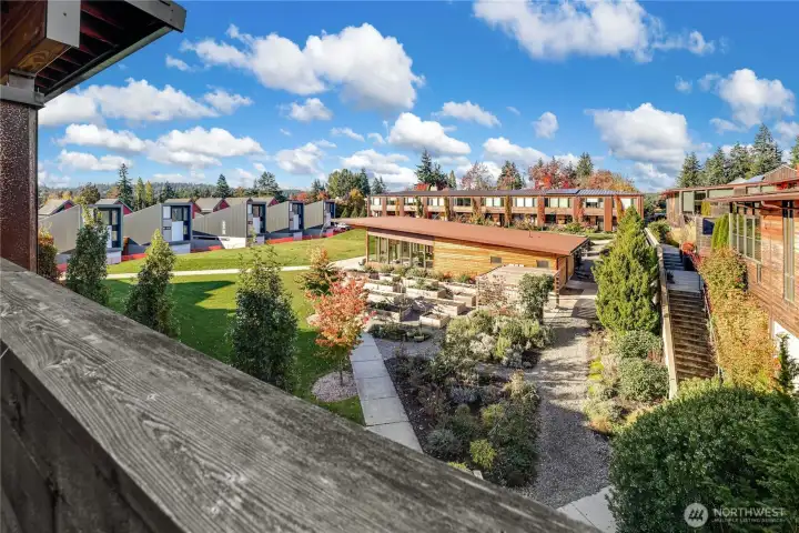 View from the balcony into the Park with community center & gardens. Unit faces west for lovely afternoon sun View from the balcony into the Park with community center & gardens. Unit faces west for lovely afternoon sun