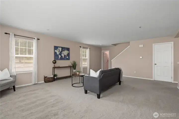 living room and coat closet/under stairs storage