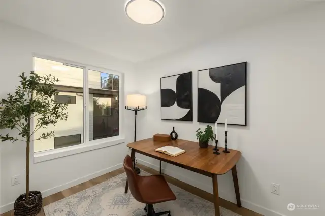A thoughtfully designed home office flooded with natural light creates the perfect productivity or quiet reflection space. Add your personal touch to make this inspiring corner truly yours.