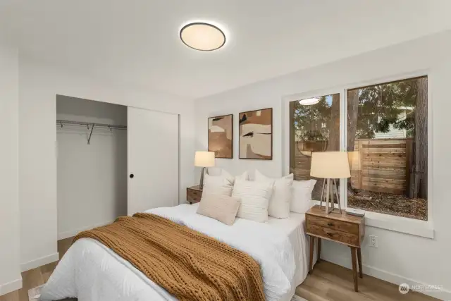 This inviting guest bedroom offers peaceful views and warm accents, making it a perfect sanctuary for relaxation or hosting loved ones. Complete with a spacious closet, it seamlessly blends comfort and practicality.