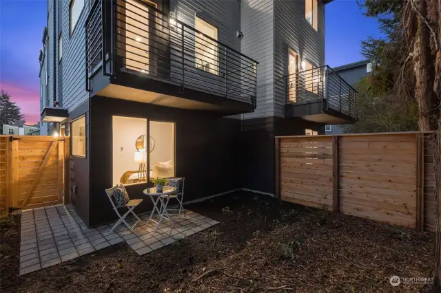 A seamless indoor-outdoor connection—enjoy the spacious patio extending from the lower level, ideal for entertaining or a quiet moment with nature.