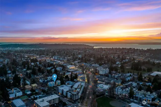 This is another captivating aerial image, with the city lights transitioning into nature and perfectly framing the property within the larger Seattle area.