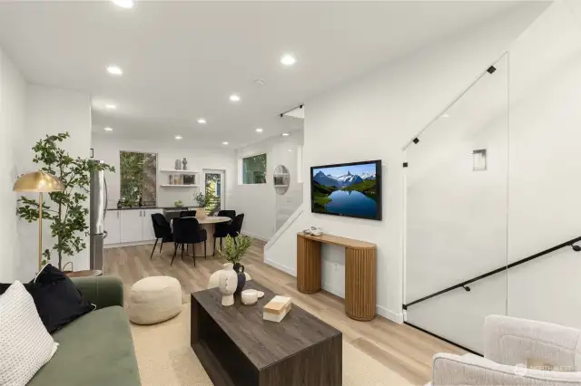 With an open-concept design and seamless flow, this living and dining space is perfect for hosting gatherings or enjoying quiet evenings. Glass accents and natural light bring a touch of elegance to every corner.