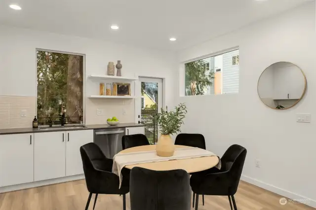 Dine with a view! This bright dining nook boasts natural light and scenic greenery, making it the ideal space to enjoy meals with family or friends.
