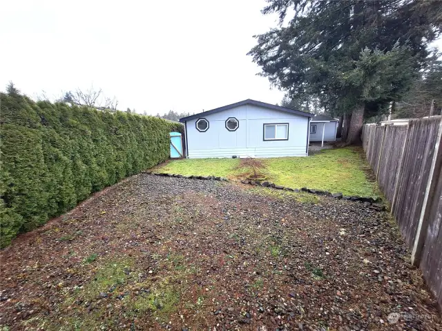 Mostly fenced back of home.