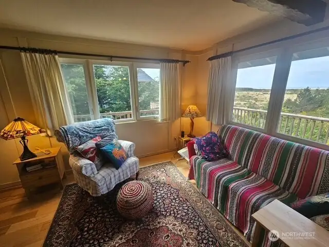 Views out of two sets of windows in the living room.