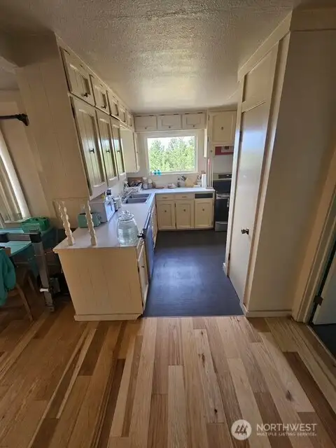 Original kitchen keeping its timeless charm with new appliances.
