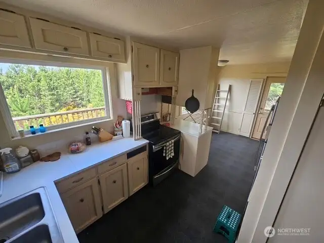 Lots of counter space and the breakfast nook that leads to the deck.