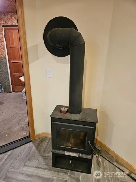 Wood burning stove for economical heating of the lower level.