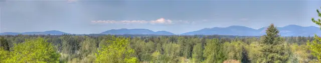 Wide angle panorama shot of Cougar, Squak and Tiger Mountains. Turn to the right and see Taylor mountain, the Rattlesnake valley, Mt SI and Mt McDonald.