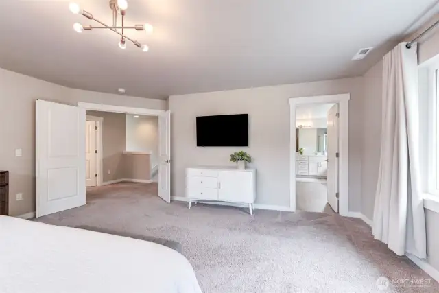 The en suite is on the right. Double doors lead out into the upper hall