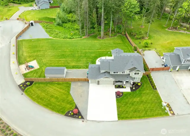 A birds' eye view of the home and acre+ lot
