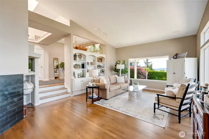Hardwood floors flow throughout much of the home.  Step down into the living and family rooms.