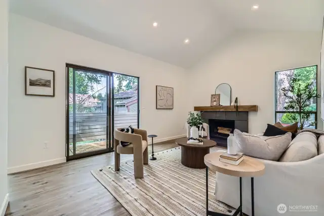 Bright & Spacious Living Looks Out onto Park-Like Courtyard & Cozy Fireplace