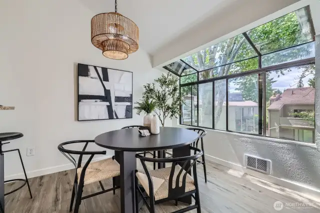 Separate Dining & Bar Soaked In Light From Atrium Windows