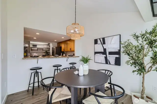 Separate Dining & Bar Soaked In Light From Atrium Windows