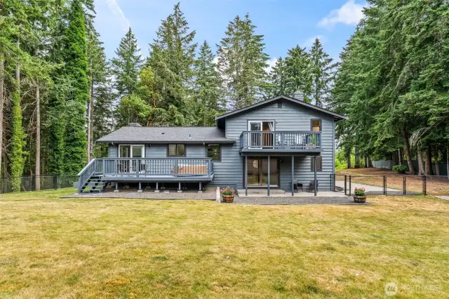 A significant portion of the acreage is the fully fenced, flat, level back yard offering SO many possibilities for roaming, playing, recreating, gardening, and more!
