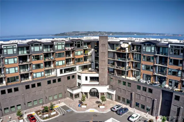 Welcome to the Rainier—Ruston's landmark building.  This isn’t just a condo. This is a lifestyle anchored by sleek design, access to trails and restaurants, and the kind of daily views you don’t grow tired of. With secured entry, private parking, and immediate proximity to the waterfront and Point Ruston shops, this building is an ideal launchpad for modern Pacific Northwest living.