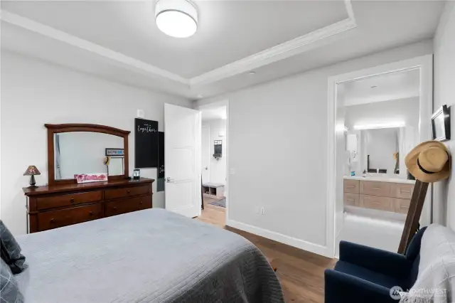 Smart layout meets effortless flow.  The primary suite connects seamlessly to a generous bathroom, making everyday routines feel indulgent. Whether you’re starting your day or winding it down, the thoughtful layout gives you privacy and comfort with zero wasted space.