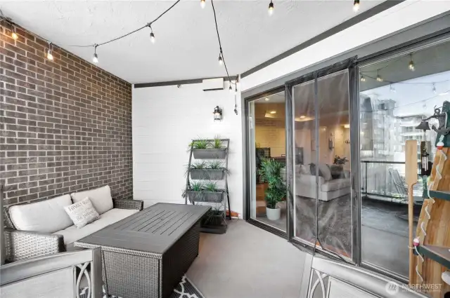 Seamless indoor-outdoor flow.  Large sliding doors blur the lines between inside and out, bringing in fresh air and natural light. Whether the doors are open for a summer breeze or closed on a rainy day, your patio is always an accessible retreat. Just another reason this condo lives larger than expected.