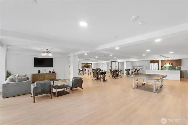 Space to gather, unwind, and connect.  This spacious community lounge is more than just a bonus—it's a social hub. With casual seating areas, a large TV, game tables, and open space to host events or unwind, this area brings residents together without leaving the building. Whether it’s a game night or a birthday celebration, it’s ready for anything.