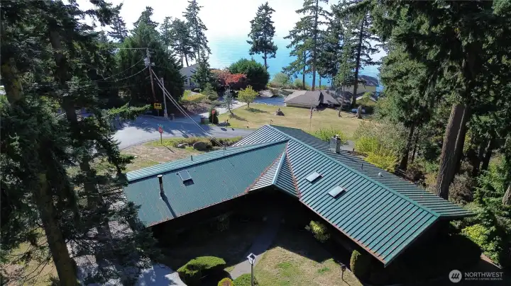 Aerial view of home looking toward water.