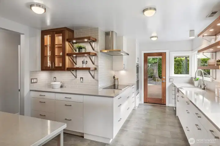 Direct access to the back deck (plumbed for gas grill) make entertaining and play a breeze.