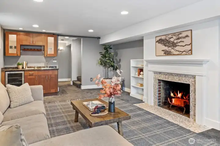 The wet bar and beverage fridge complete the space—perfect for entertaining or guest use.