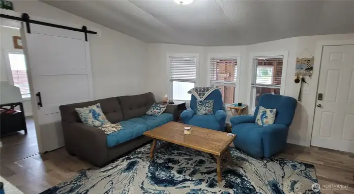 Open concept living area opens to kitchen.